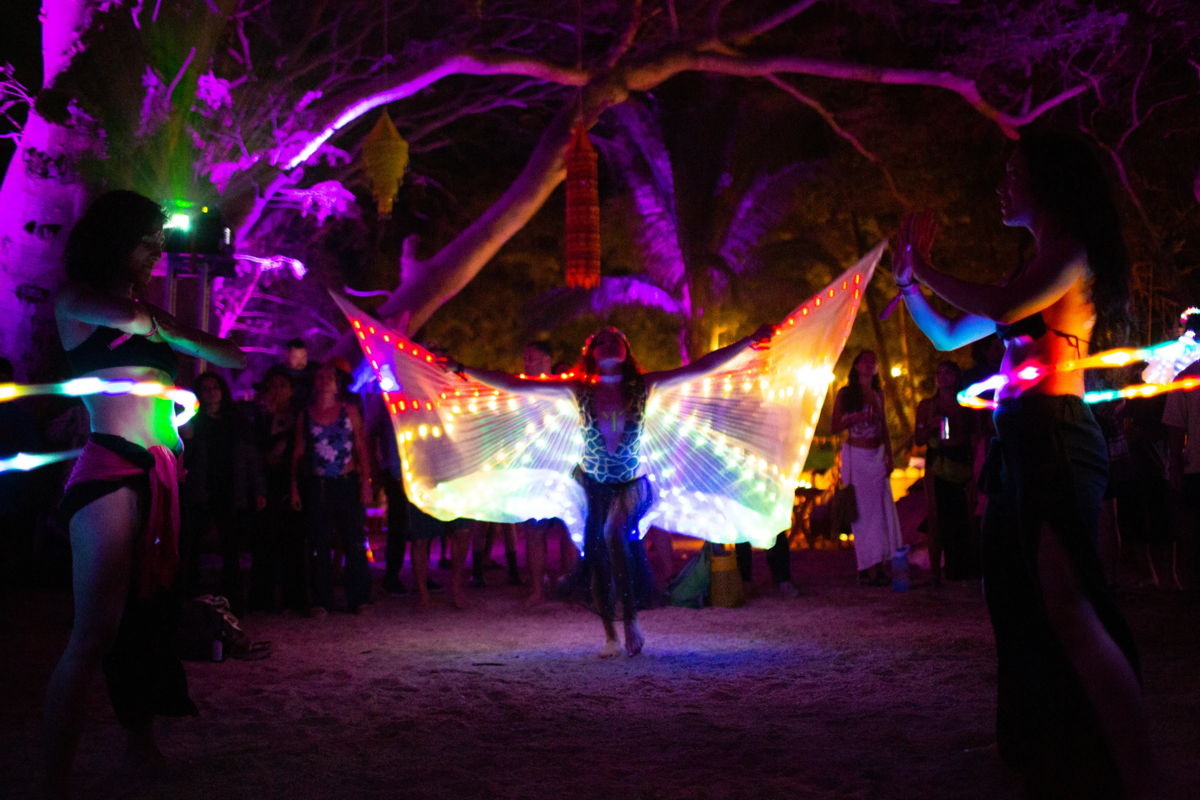 An illuminated stage among trees