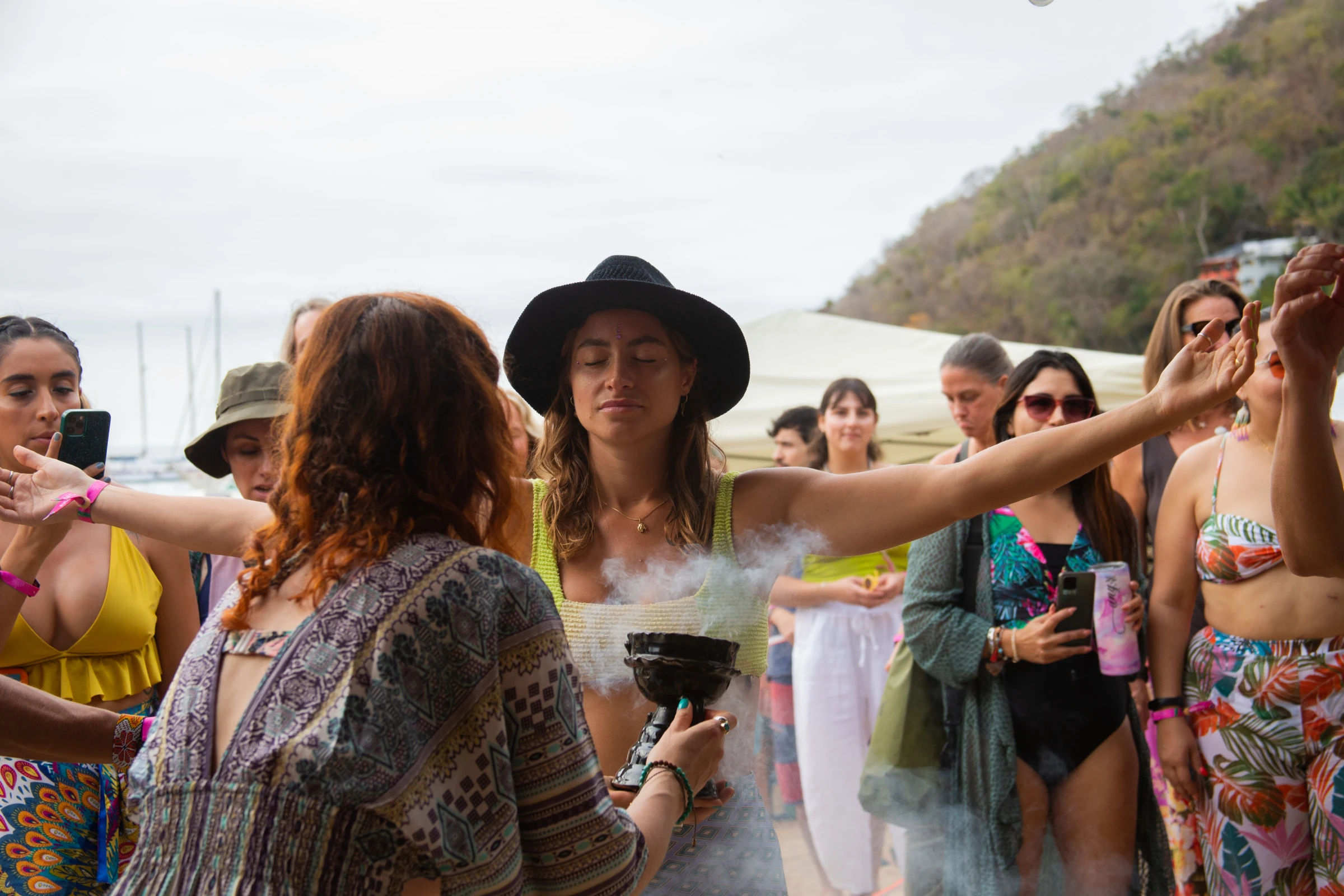 A participant with her eyes closed during an outdoor activity